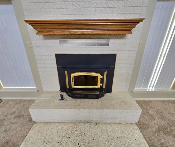 a living room with a fireplace