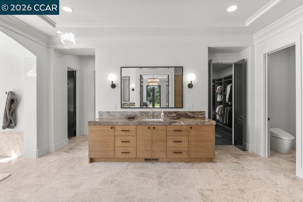 640 El Pintado Road Danville, CA 94526 - Photo 28 of 60 a bathroom with a granite countertop sink and a mirror