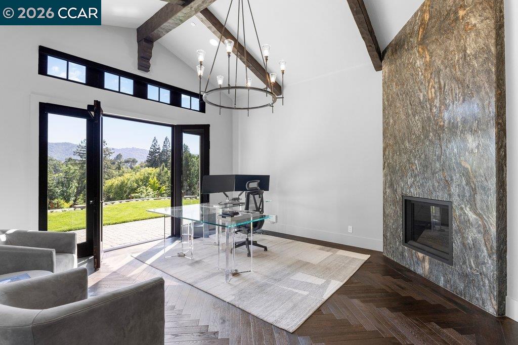 640 El Pintado Road Danville, CA 94526 - Photo 35 of 60 a living room with furniture floor to ceiling window and a fireplace