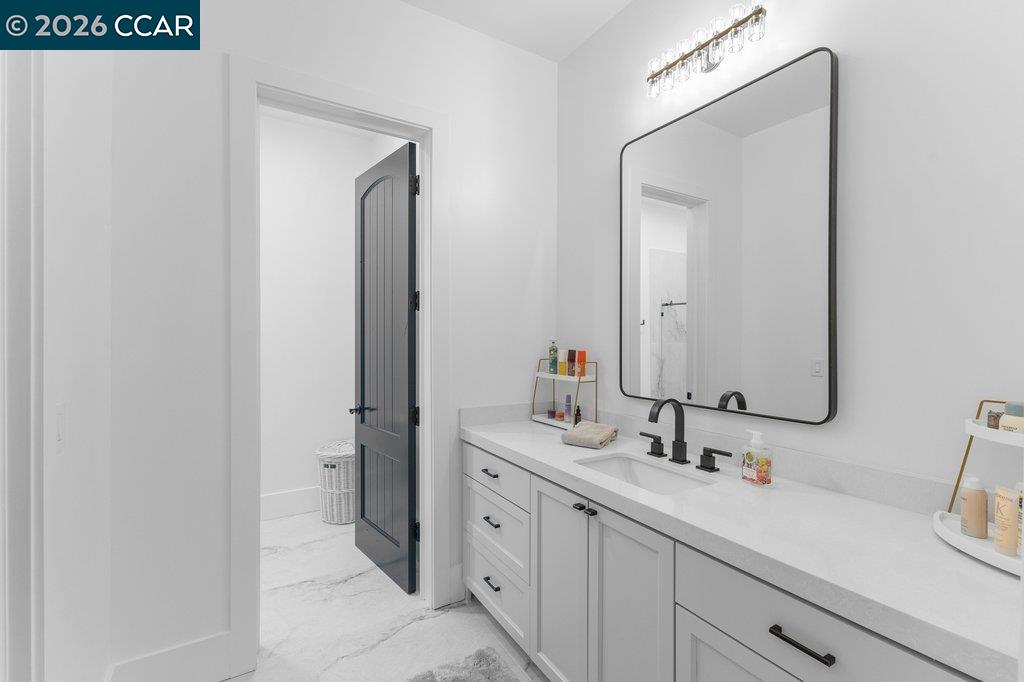 640 El Pintado Road Danville, CA 94526 - Photo 37 of 60 a bathroom with a double vanity sink and mirror