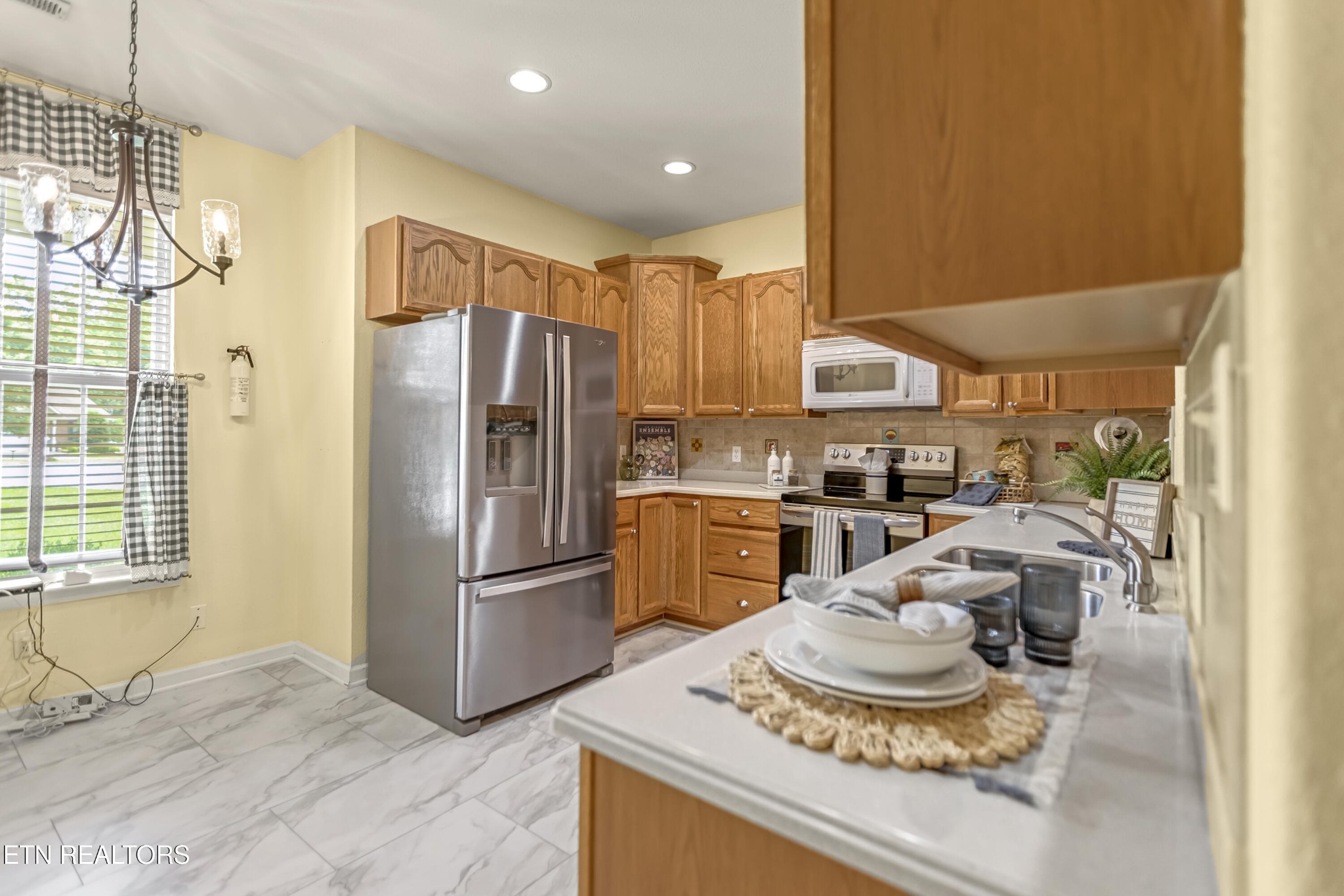 7204 Oakfield Lane Powell, TN 37849 - Photo 12 of 43 a kitchen with a refrigerator and a sink