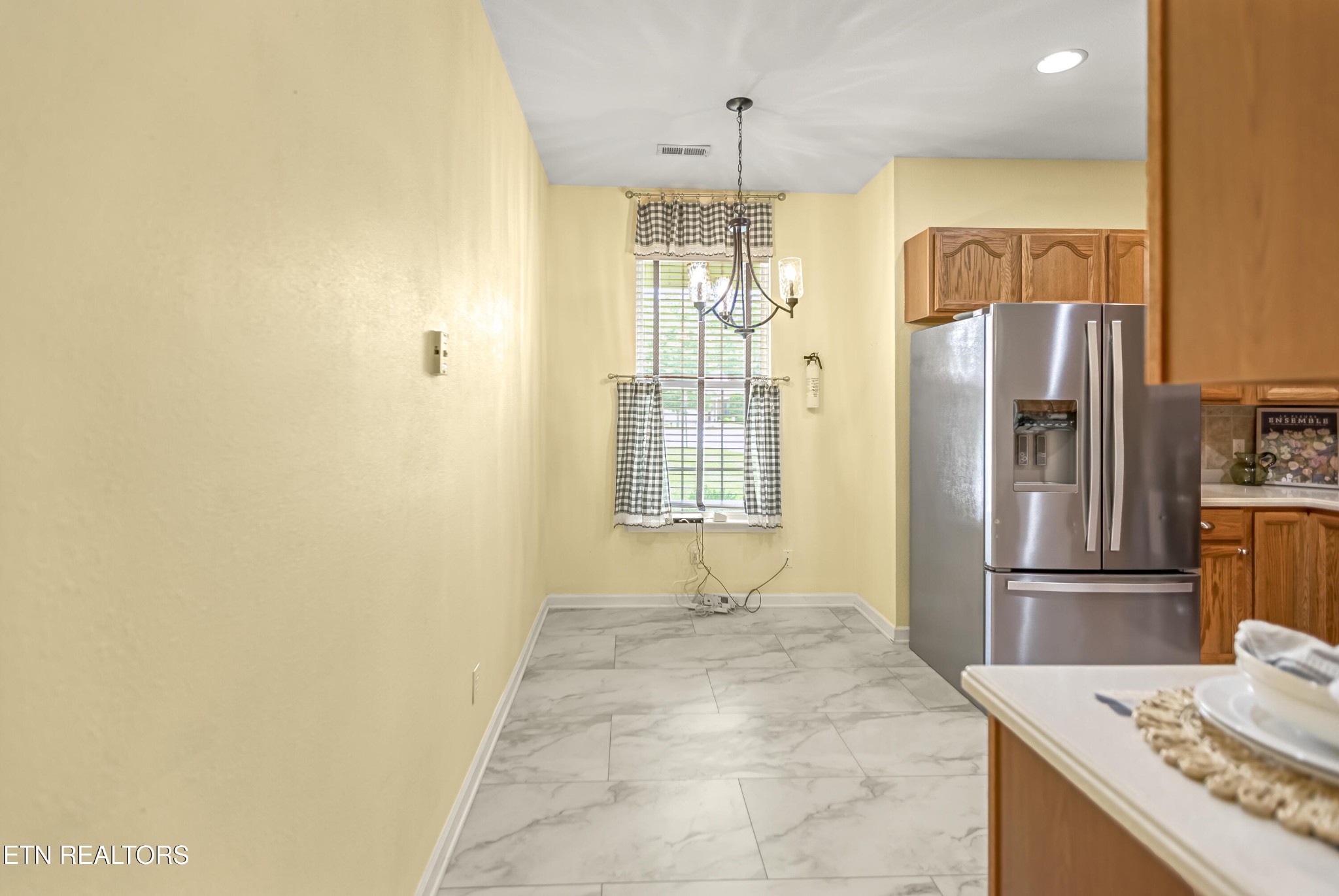 7204 Oakfield Lane Powell, TN 37849 - Photo 14 of 43 a bathroom with a granite countertop sink a shower and a mirror
