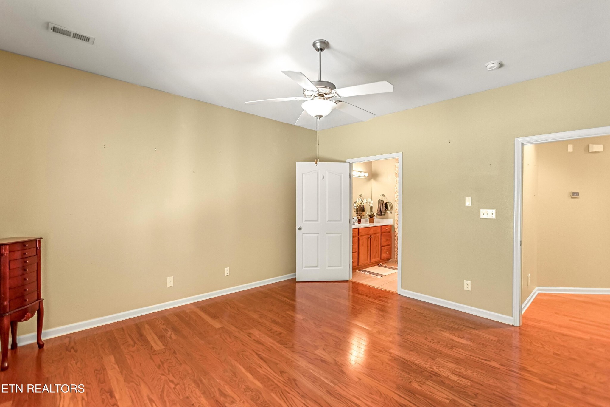 7204 Oakfield Lane Powell, TN 37849 - Photo 16 of 43 an empty room with wooden floor and ceiling fan