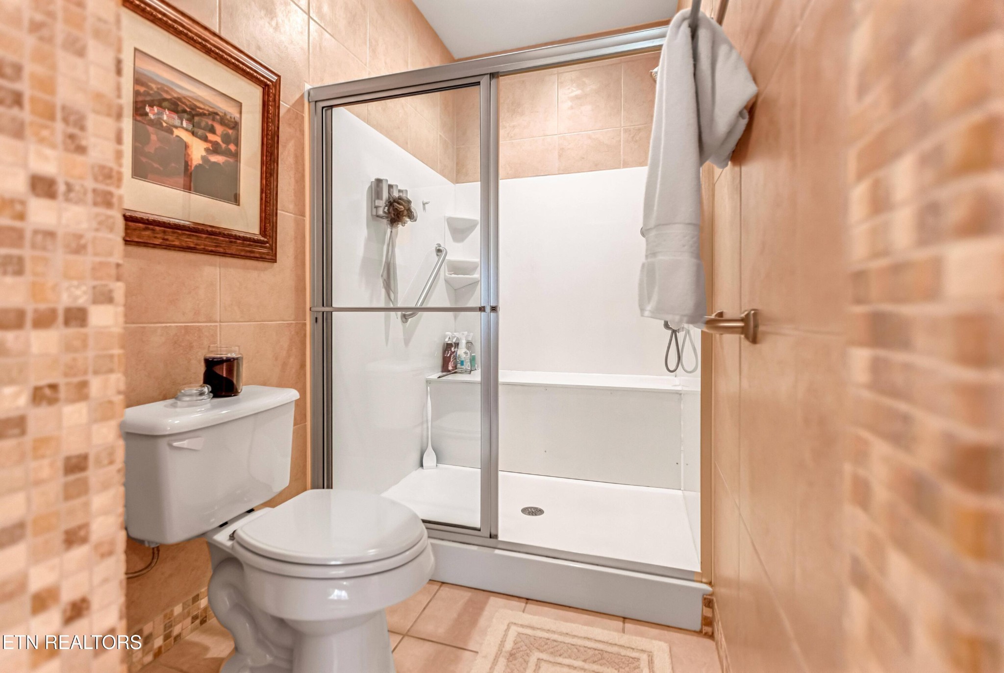 7204 Oakfield Lane Powell, TN 37849 - Photo 18 of 43 a bathroom with a toilet and a shower
