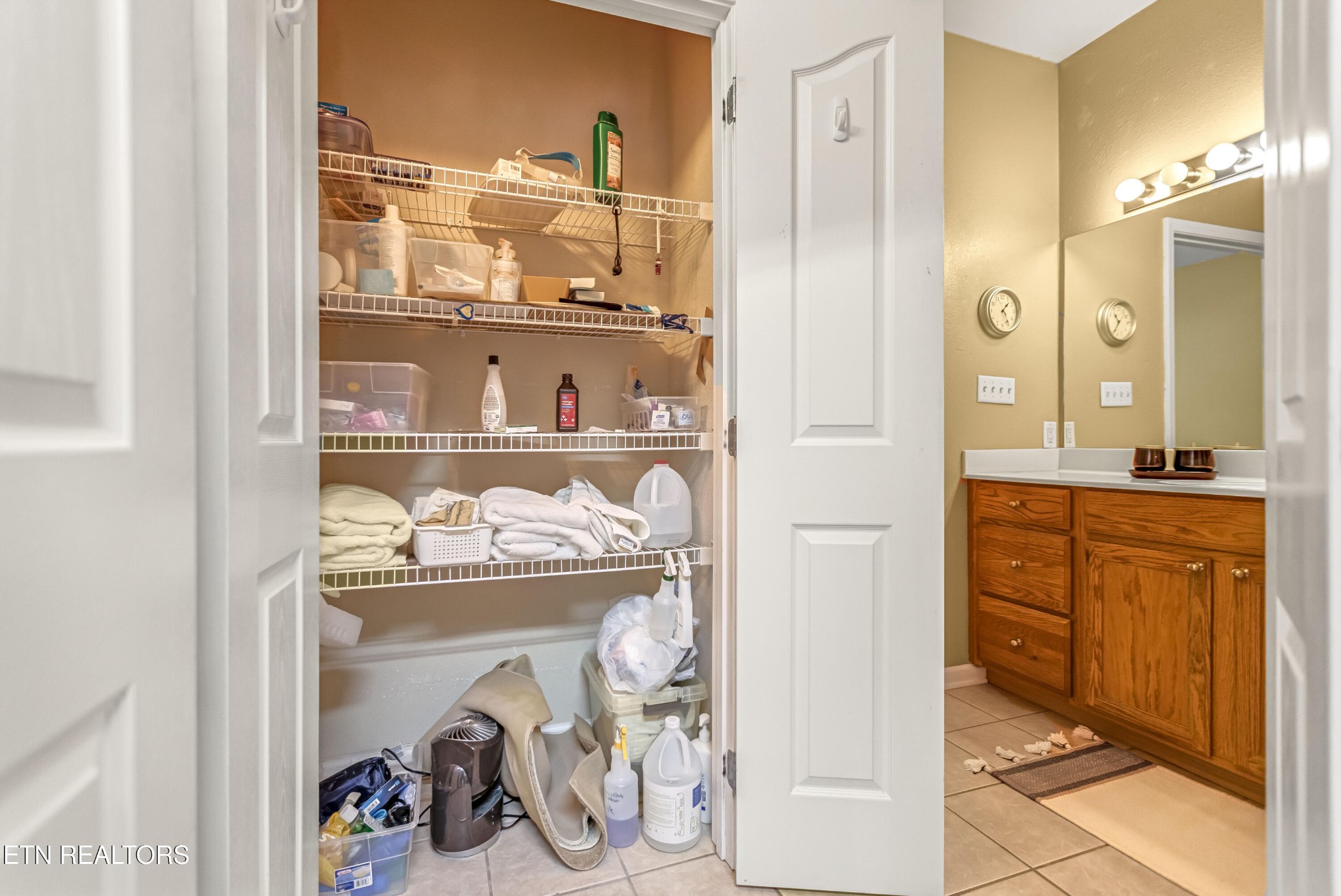 7204 Oakfield Lane Powell, TN 37849 - Photo 19 of 43 a bathroom with a sink a mirror and a shower