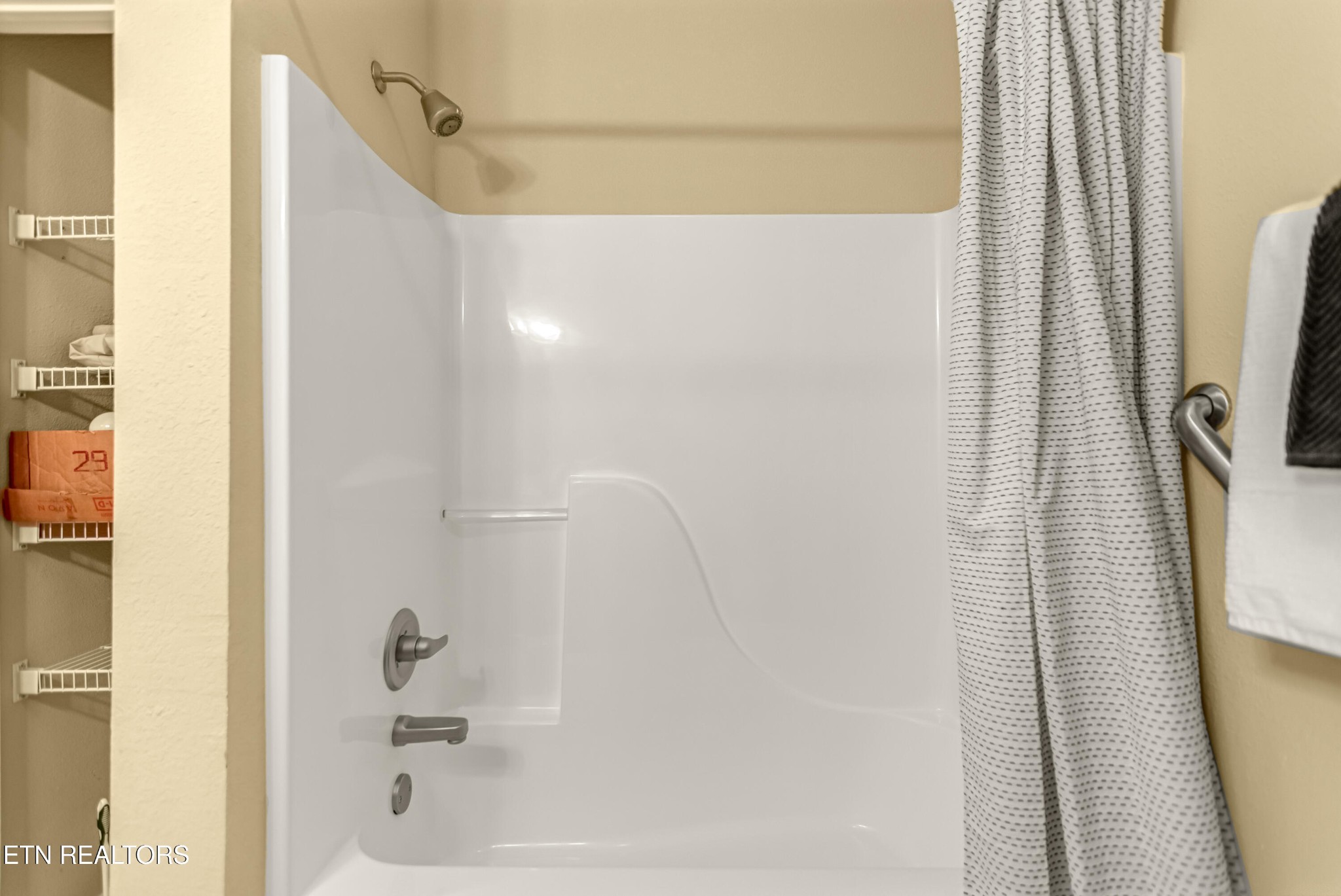 7204 Oakfield Lane Powell, TN 37849 - Photo 27 of 43 a bathroom with a shower and a tub