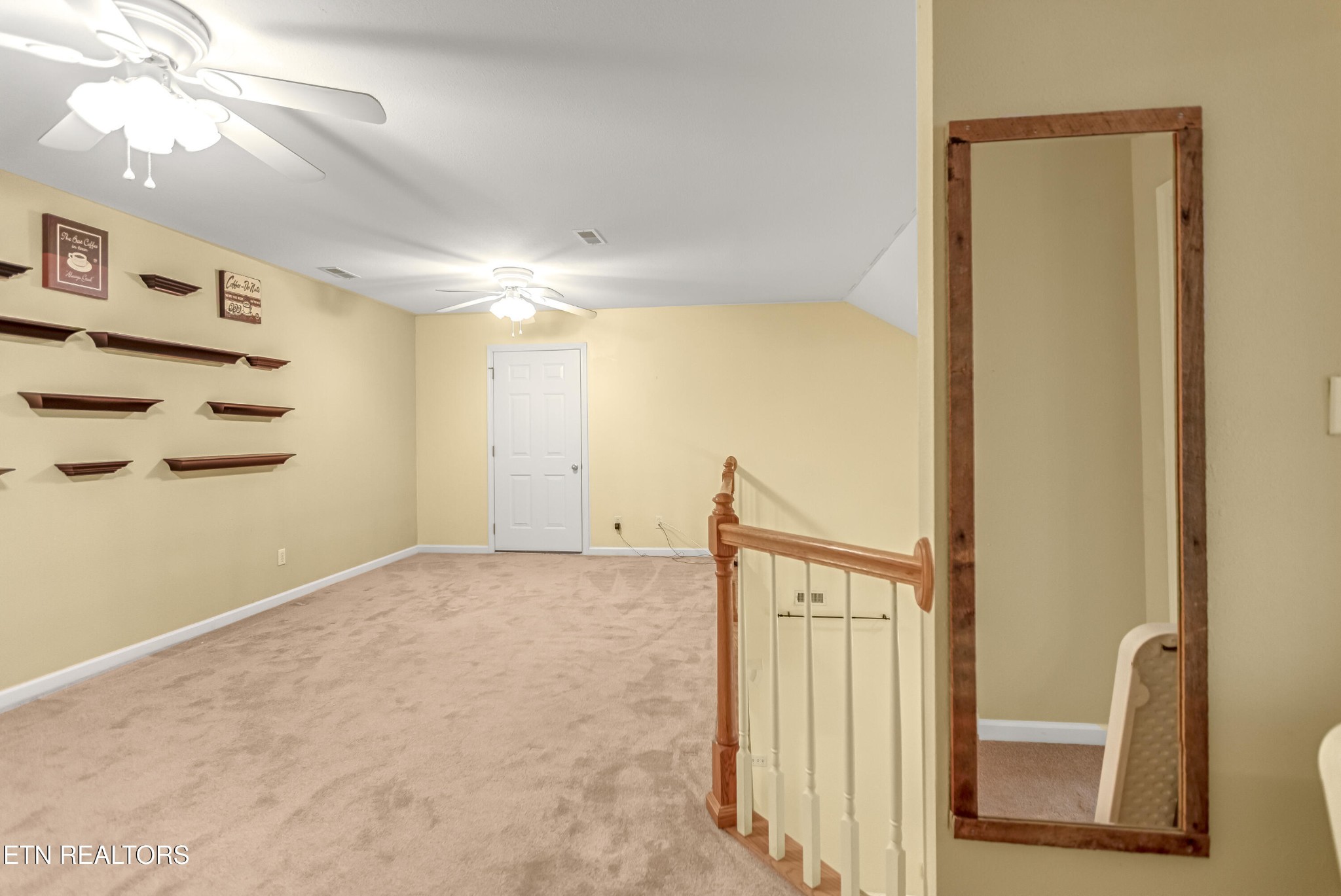 7204 Oakfield Lane Powell, TN 37849 - Photo 35 of 43 a view of a hallway to a bedroom with wooden floor and windows
