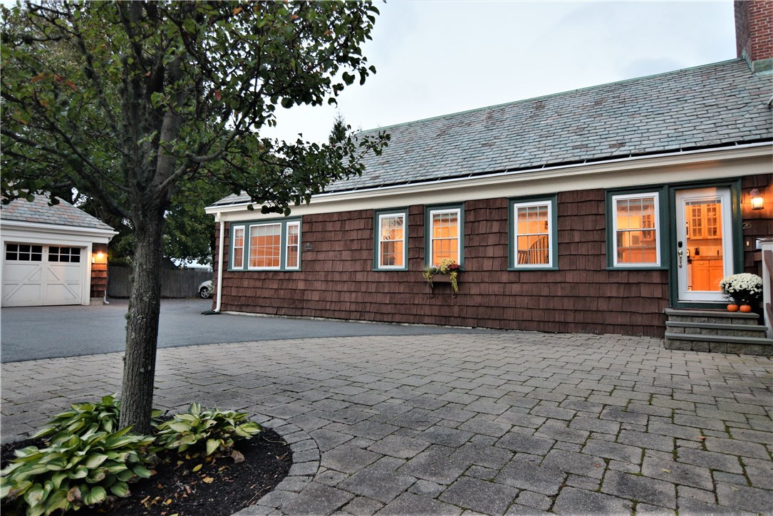 Tranquil courtyard with original shingles and slate roof.