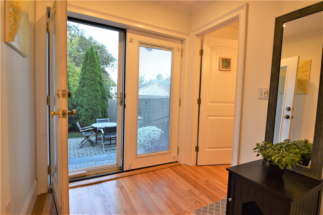 26 Phelps Road Middletown, RI 02842 - Photo 20 of 27 French doors lead out to private patio - the second full bathroom to the right.