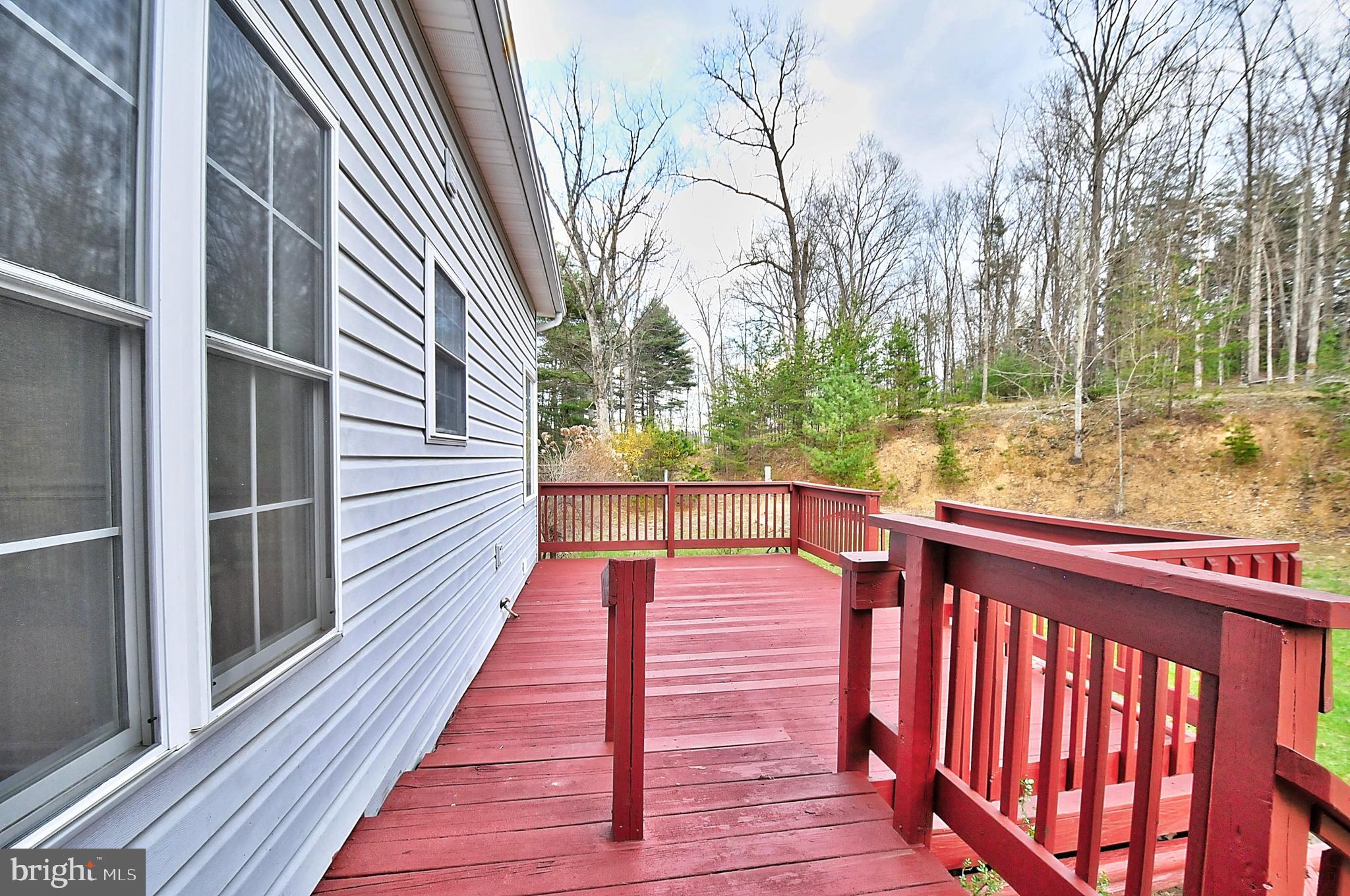 235 Peppermint Spring Lane Winchester, VA 22603 - Photo 7 of 90 a view of balcony with wooden floor and fence and floor
