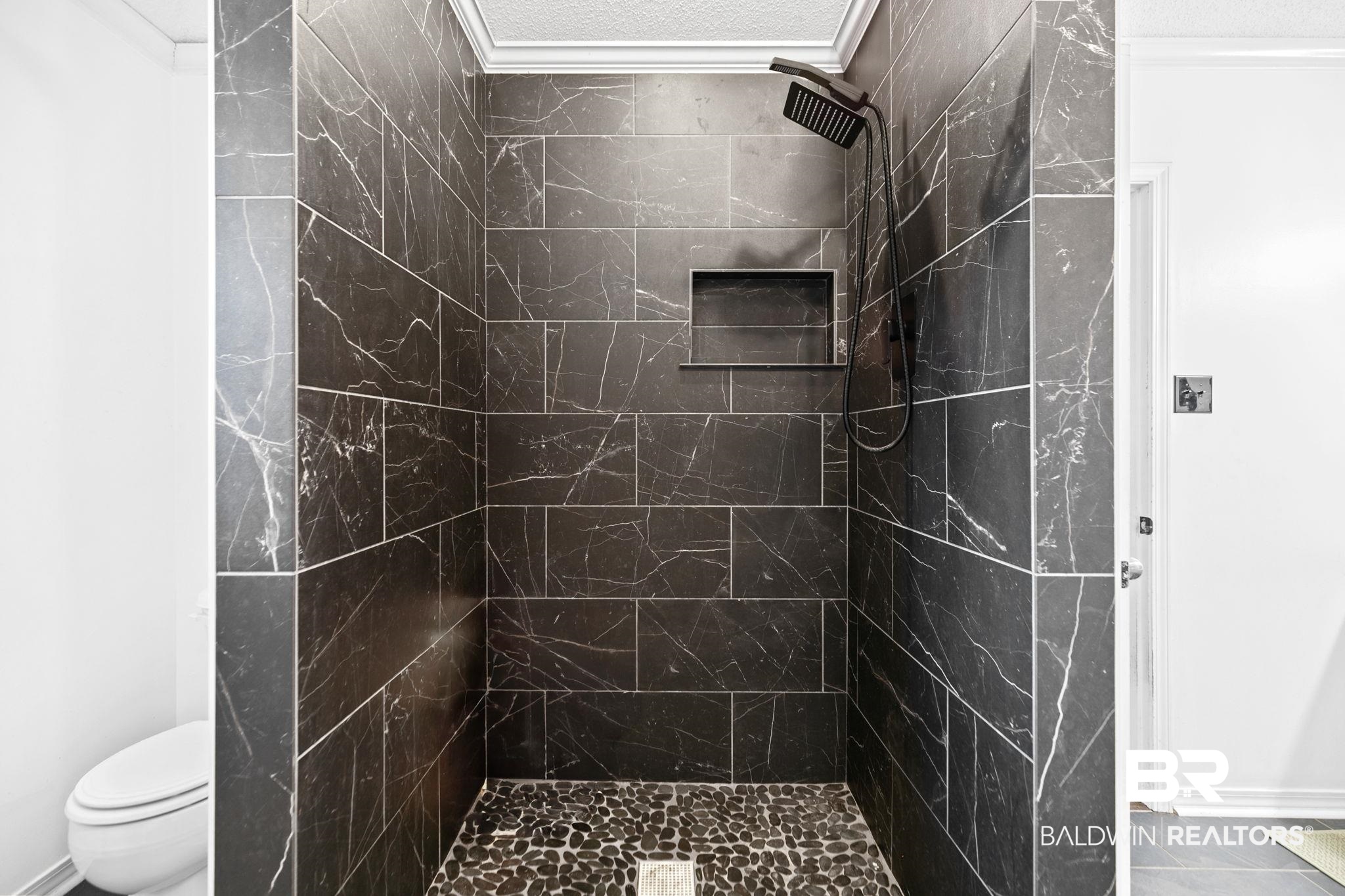 10550 Patrick Avenue Grand Bay, AL 36541 - Photo 27 of 43 Bathroom with tile patterned flooring, toilet, and a tile shower