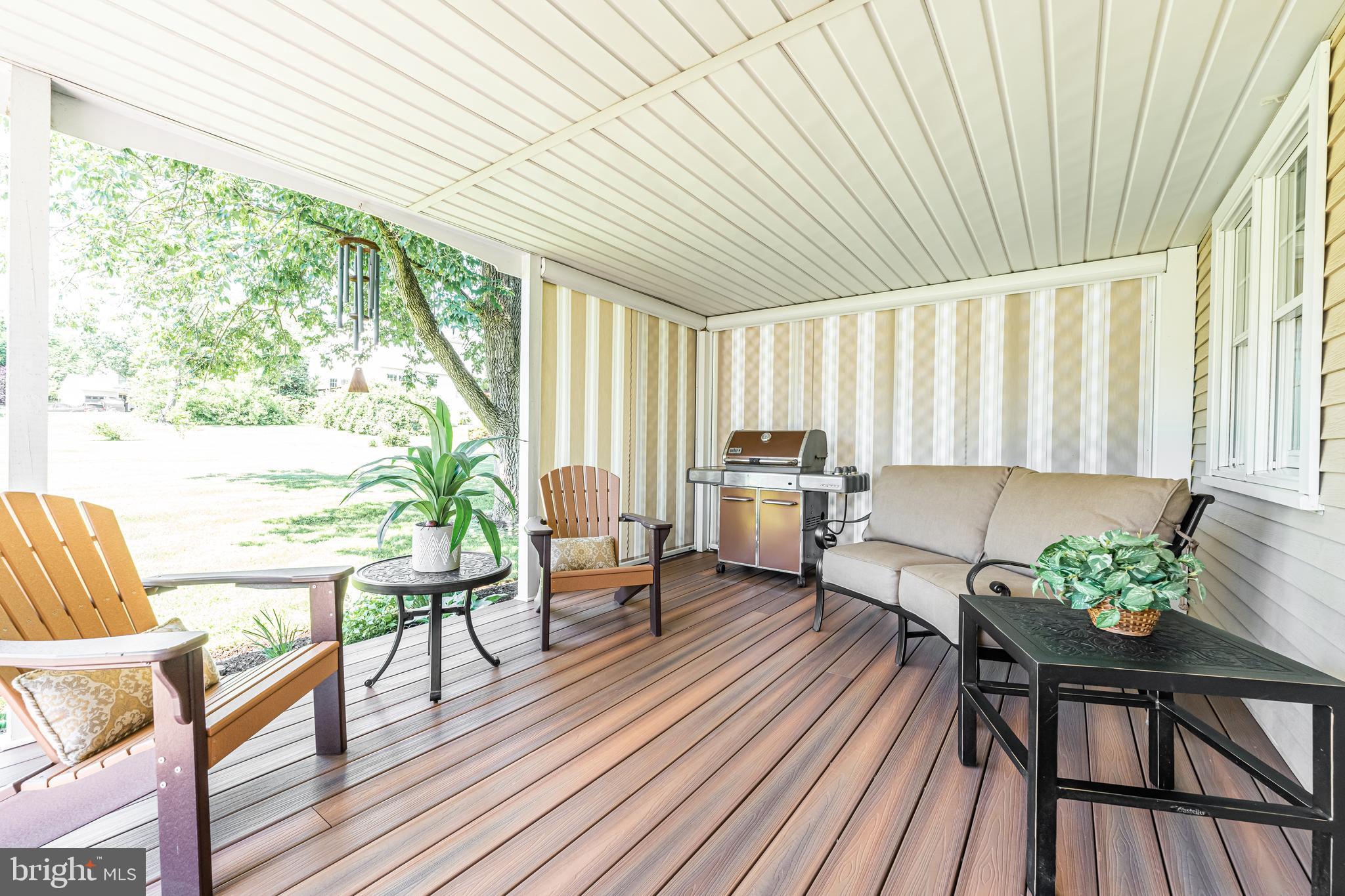 414 Yoder Road Harleysville, PA 19438 - Photo 42 of 57 Covered rear porch with electric privacy shades