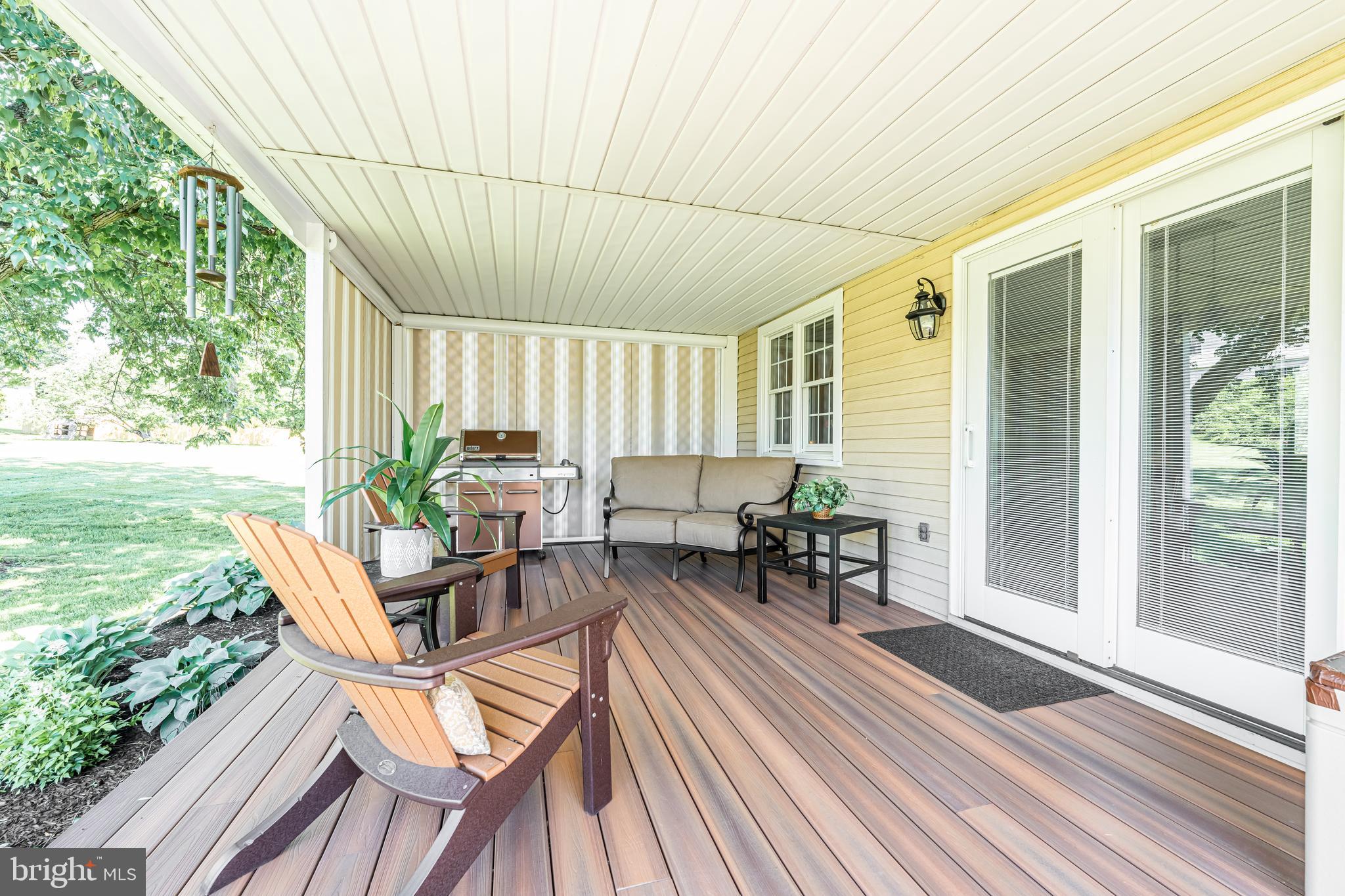 414 Yoder Road Harleysville, PA 19438 - Photo 43 of 57 Covered rear porch with electric privacy shades