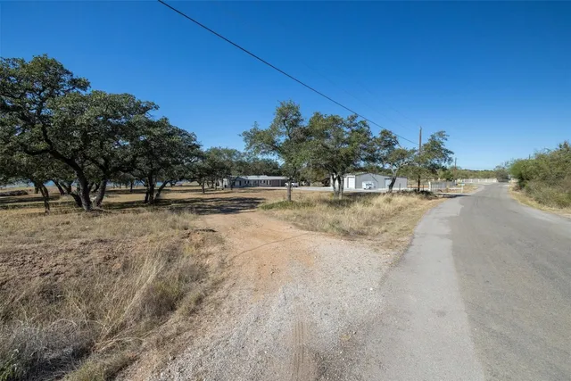 a view of road with trees