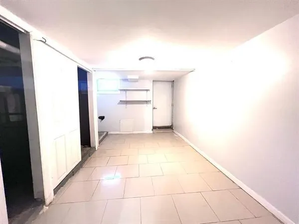 a view of utility room with closet