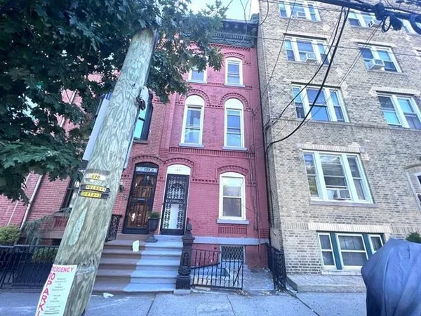 a view of a brick building with many windows
