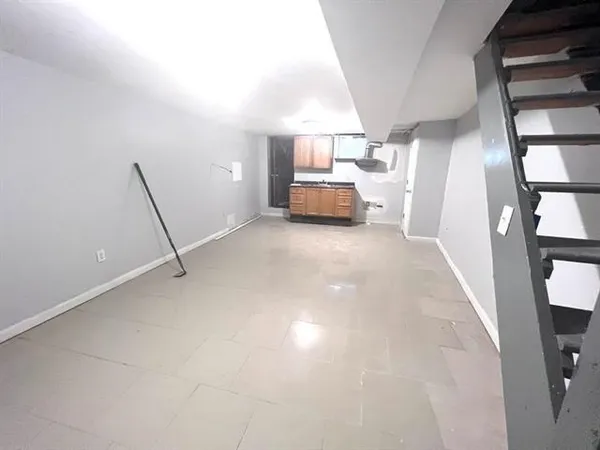a view of a livingroom with furniture and a large window