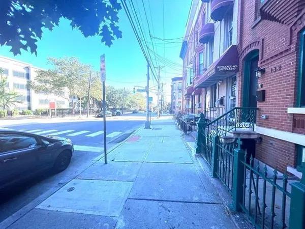 a view of a pathway with a yard