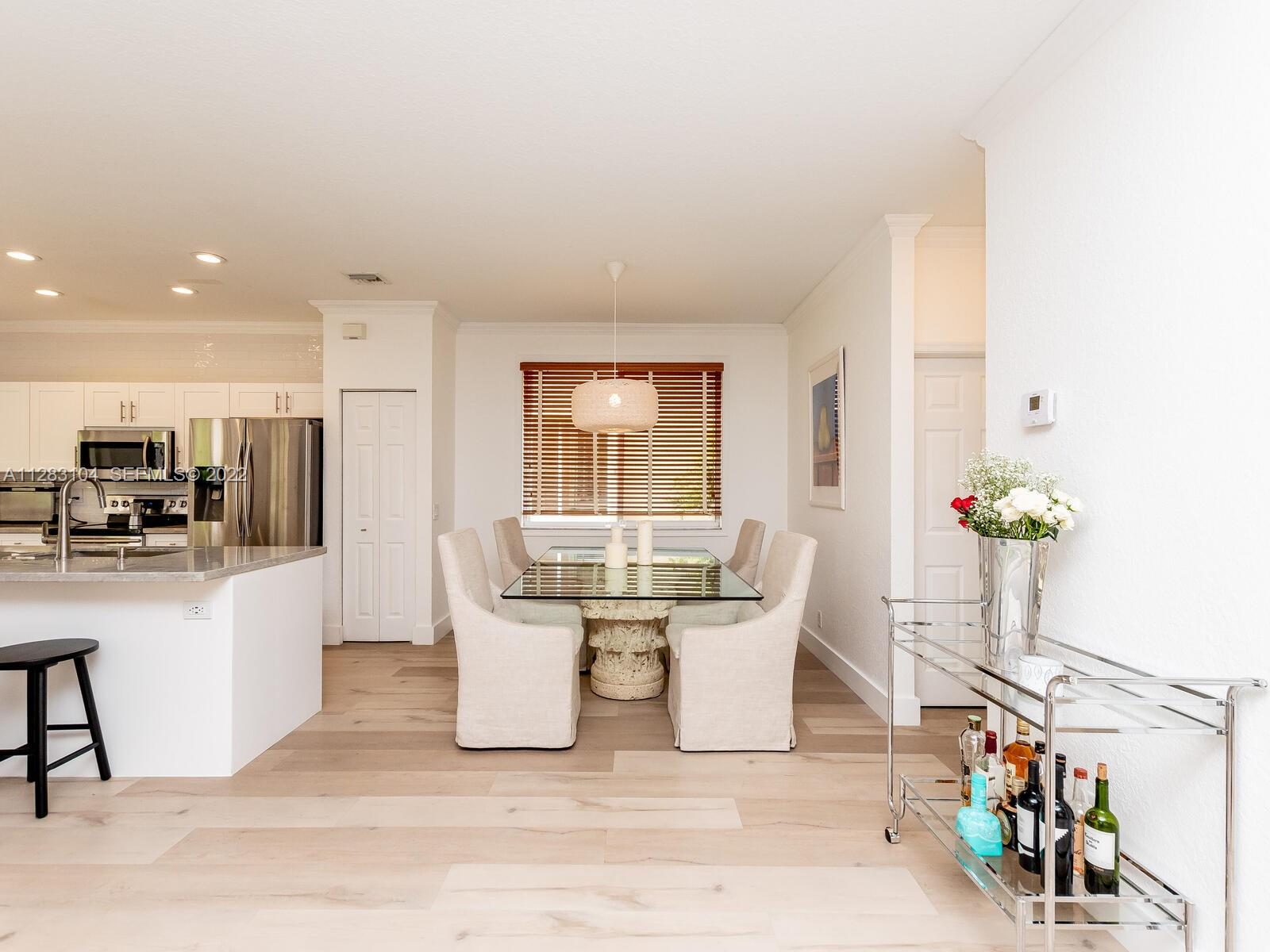 471 Fishtail Terrace Weston, FL 33327 - Photo 12 of 64 a living room with furniture a dining table and a potted plant