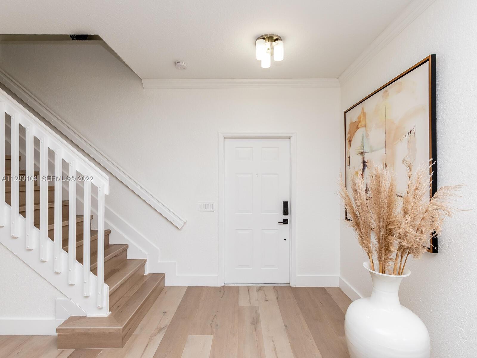 471 Fishtail Terrace Weston, FL 33327 - Photo 13 of 64 a view of an entryway with wooden floor