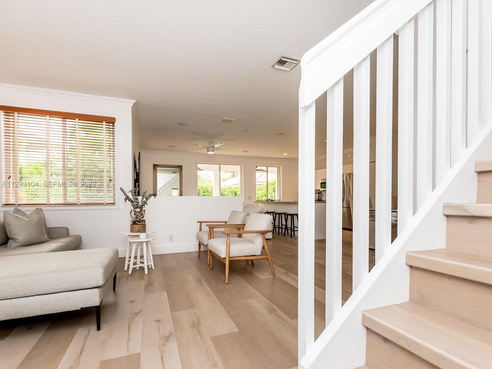 471 Fishtail Terrace Weston, FL 33327 - Photo 17 of 64 a view of a living room filled with furniture and a large window