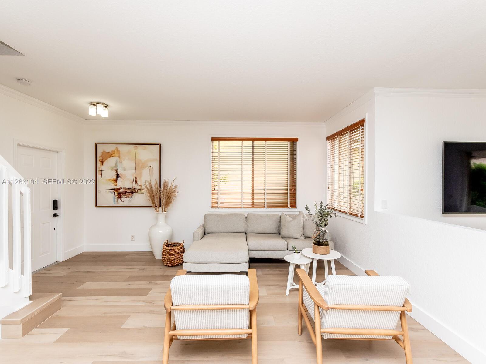 471 Fishtail Terrace Weston, FL 33327 - Photo 22 of 64 a living room with furniture and a flat screen tv