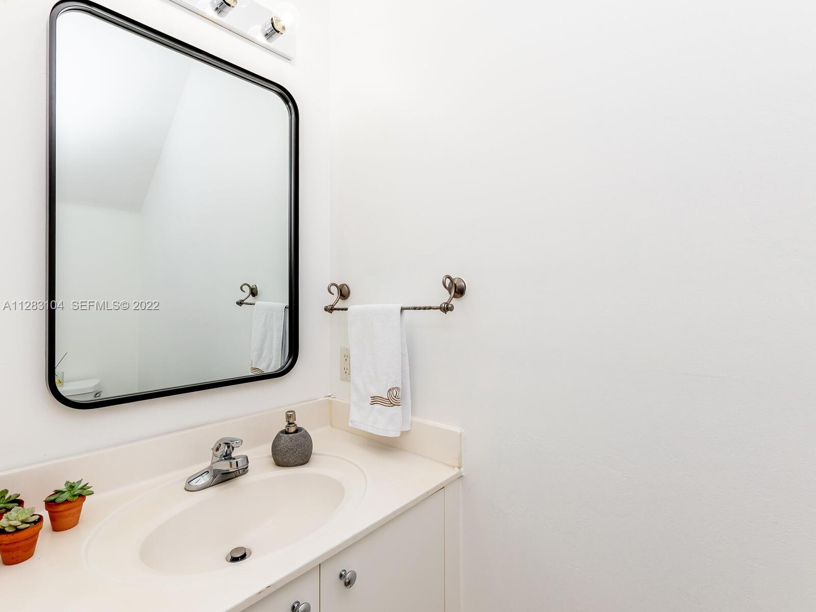 471 Fishtail Terrace Weston, FL 33327 - Photo 24 of 64 a bathroom with a sink and a mirror