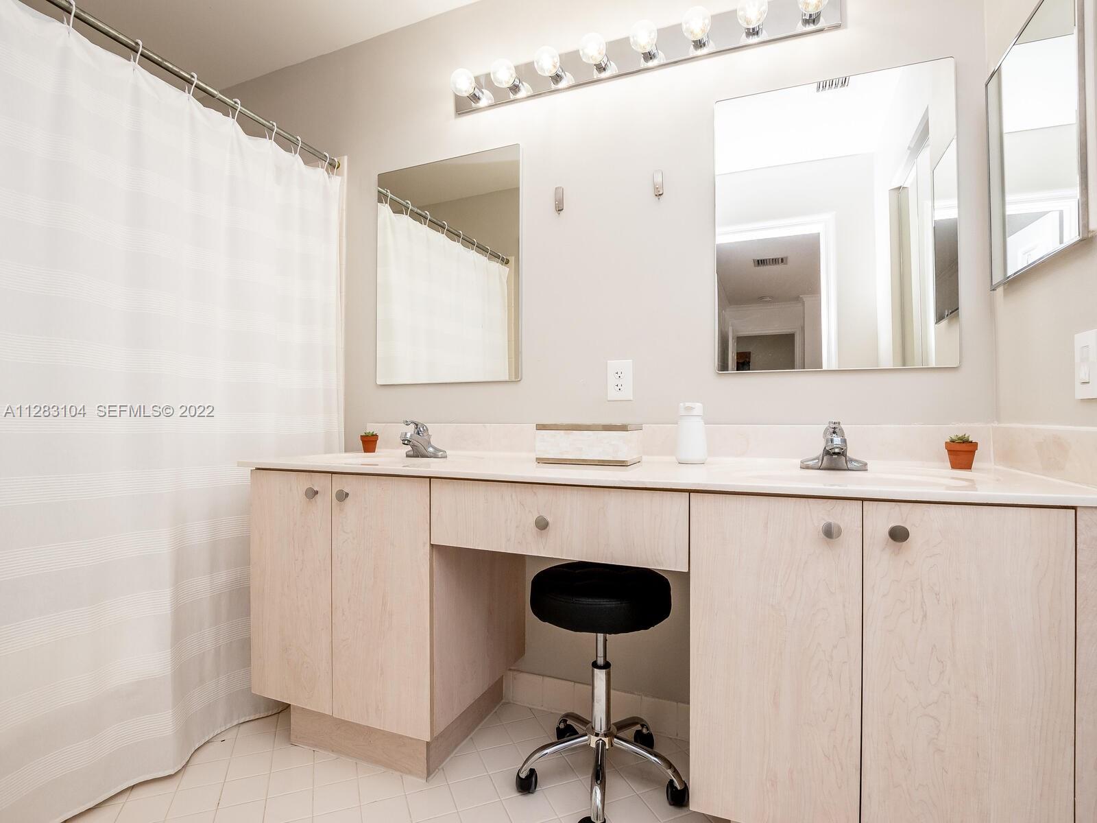 471 Fishtail Terrace Weston, FL 33327 - Photo 35 of 64 a bathroom with a sink and a mirror