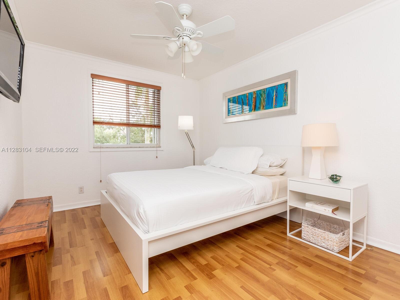 471 Fishtail Terrace Weston, FL 33327 - Photo 37 of 64 a bedroom with a bed and a window