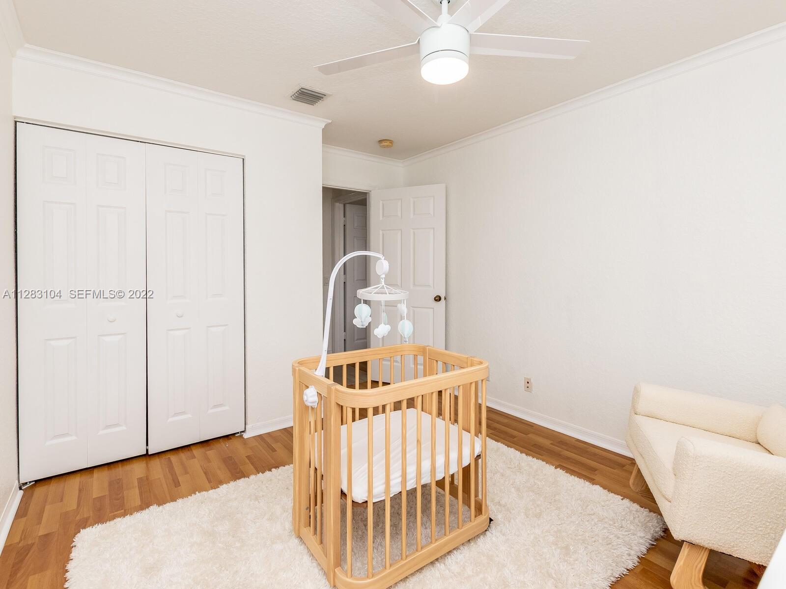 471 Fishtail Terrace Weston, FL 33327 - Photo 42 of 64 a bedroom with a bed and a chair