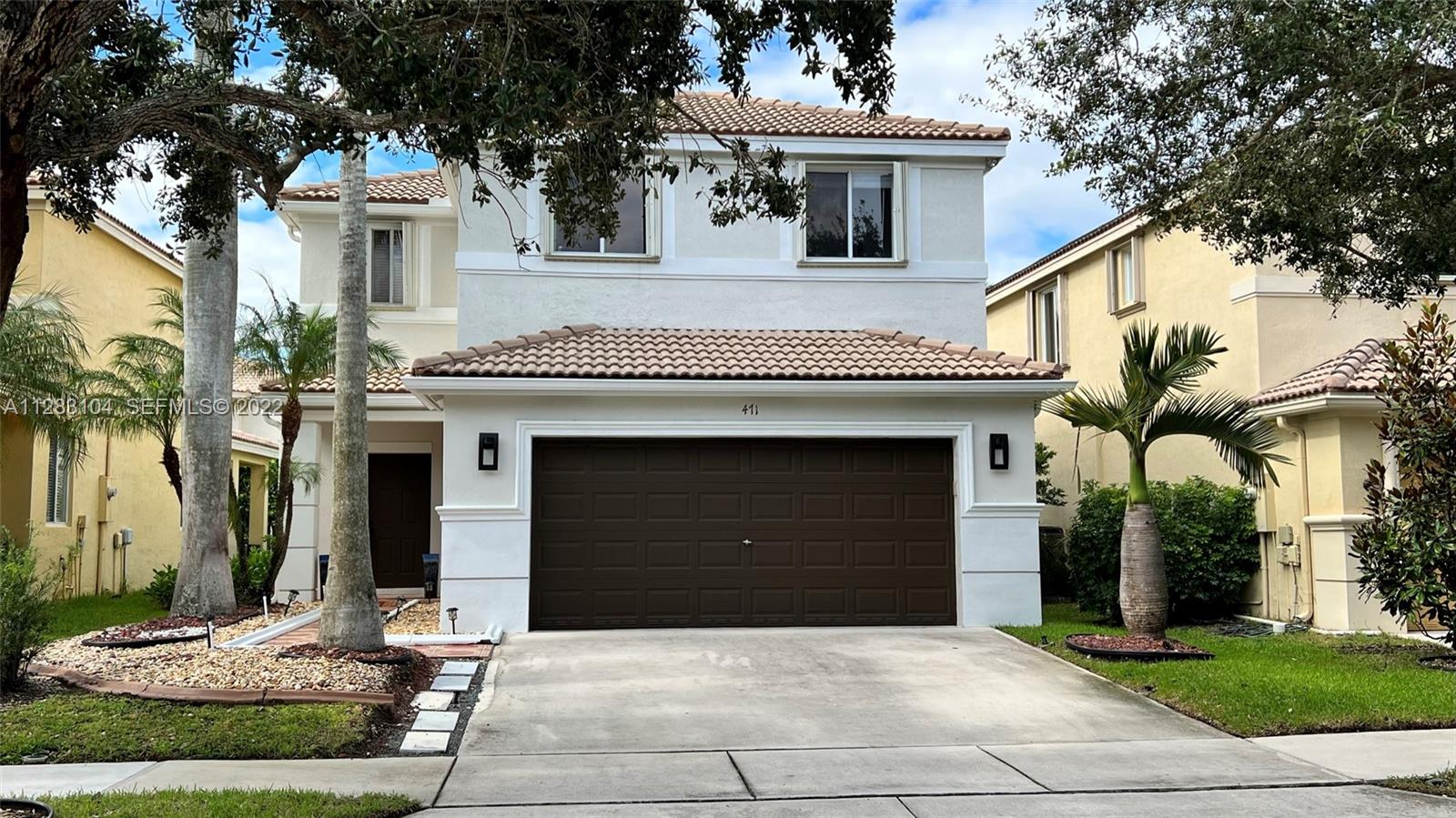 471 Fishtail Terrace Weston, FL 33327 - Photo 56 of 64 a front view of a house with yard