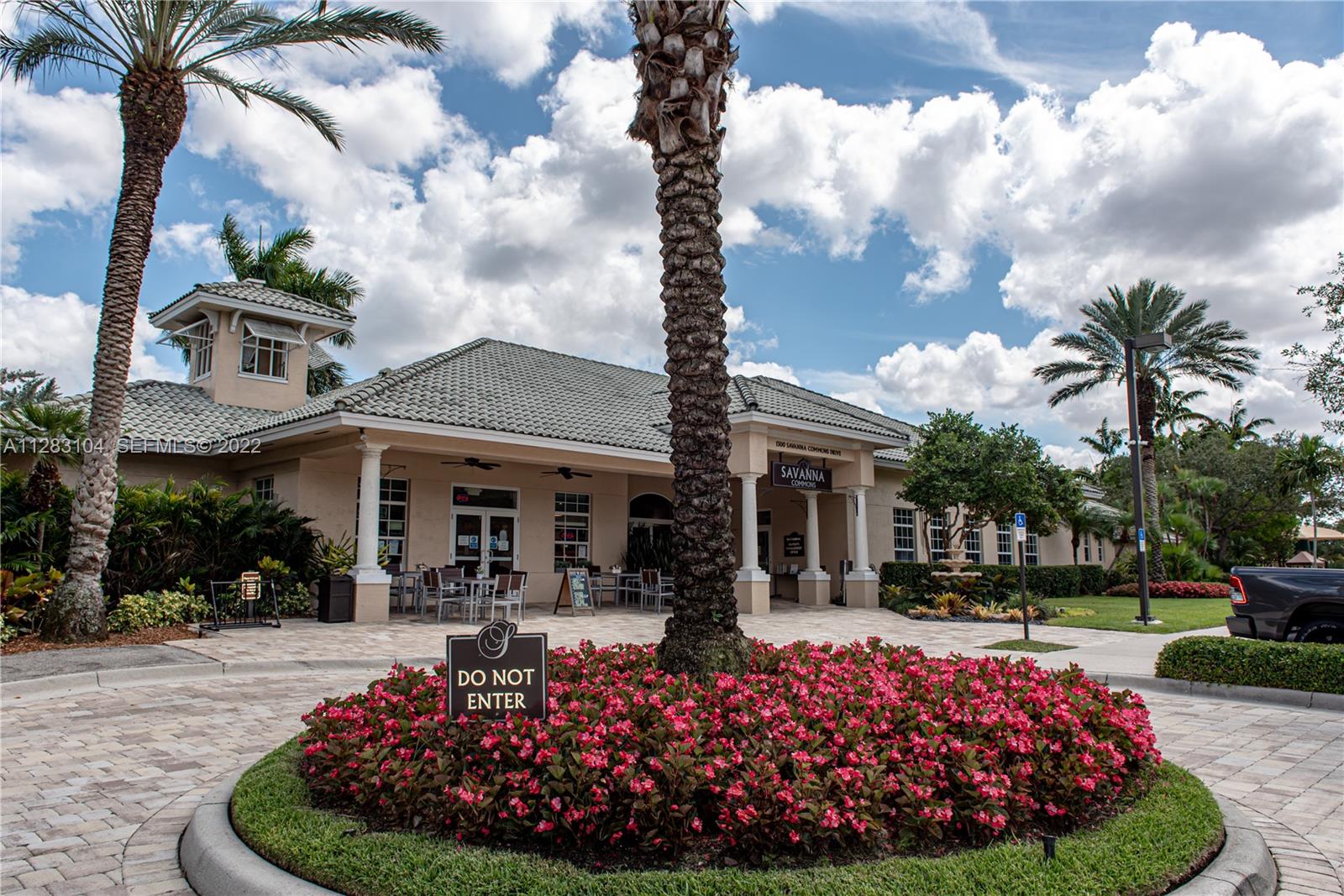 471 Fishtail Terrace Weston, FL 33327 - Photo 58 of 64 a front view of a house with garden