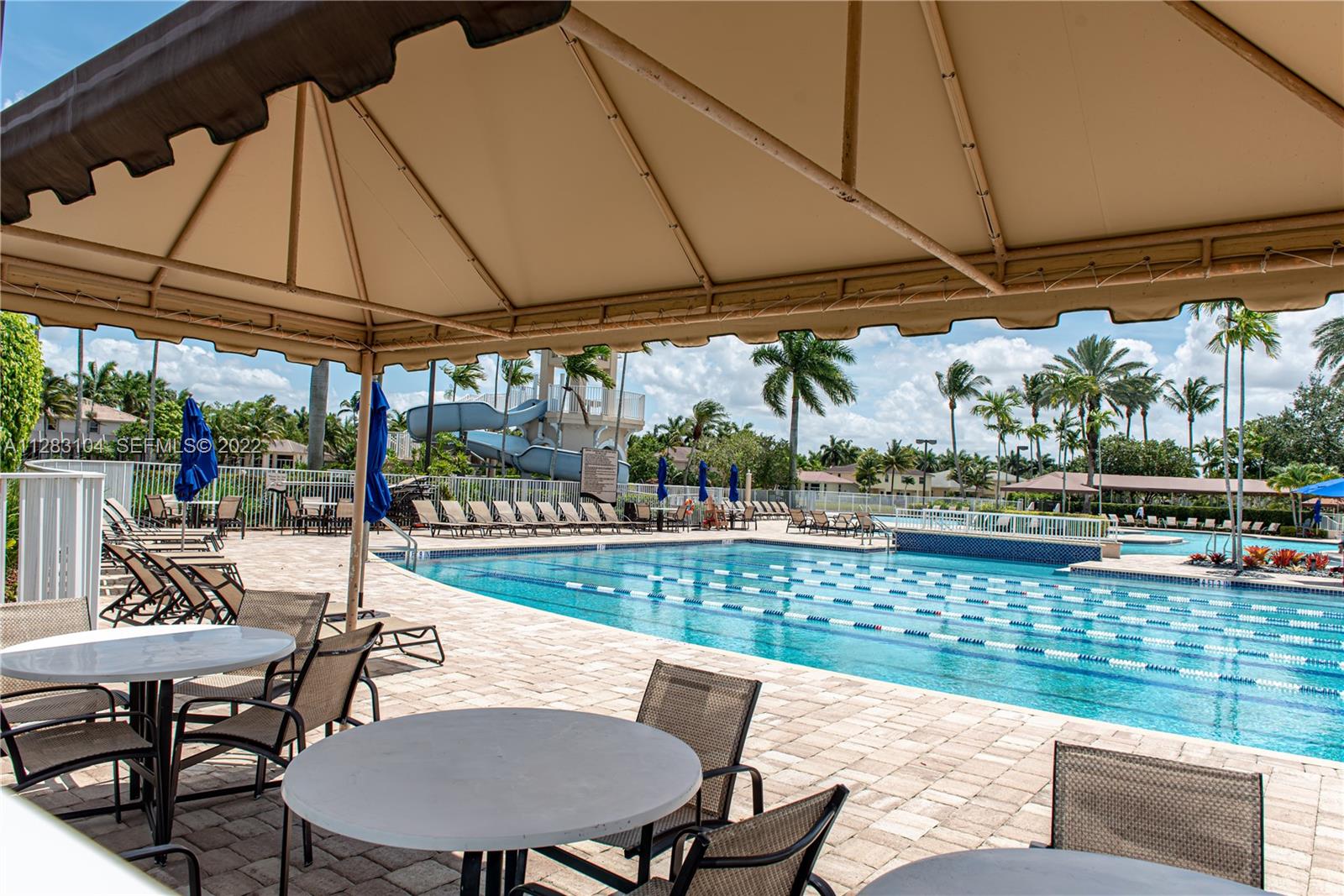 471 Fishtail Terrace Weston, FL 33327 - Photo 59 of 64 a view of a patio with a table chairs and a table