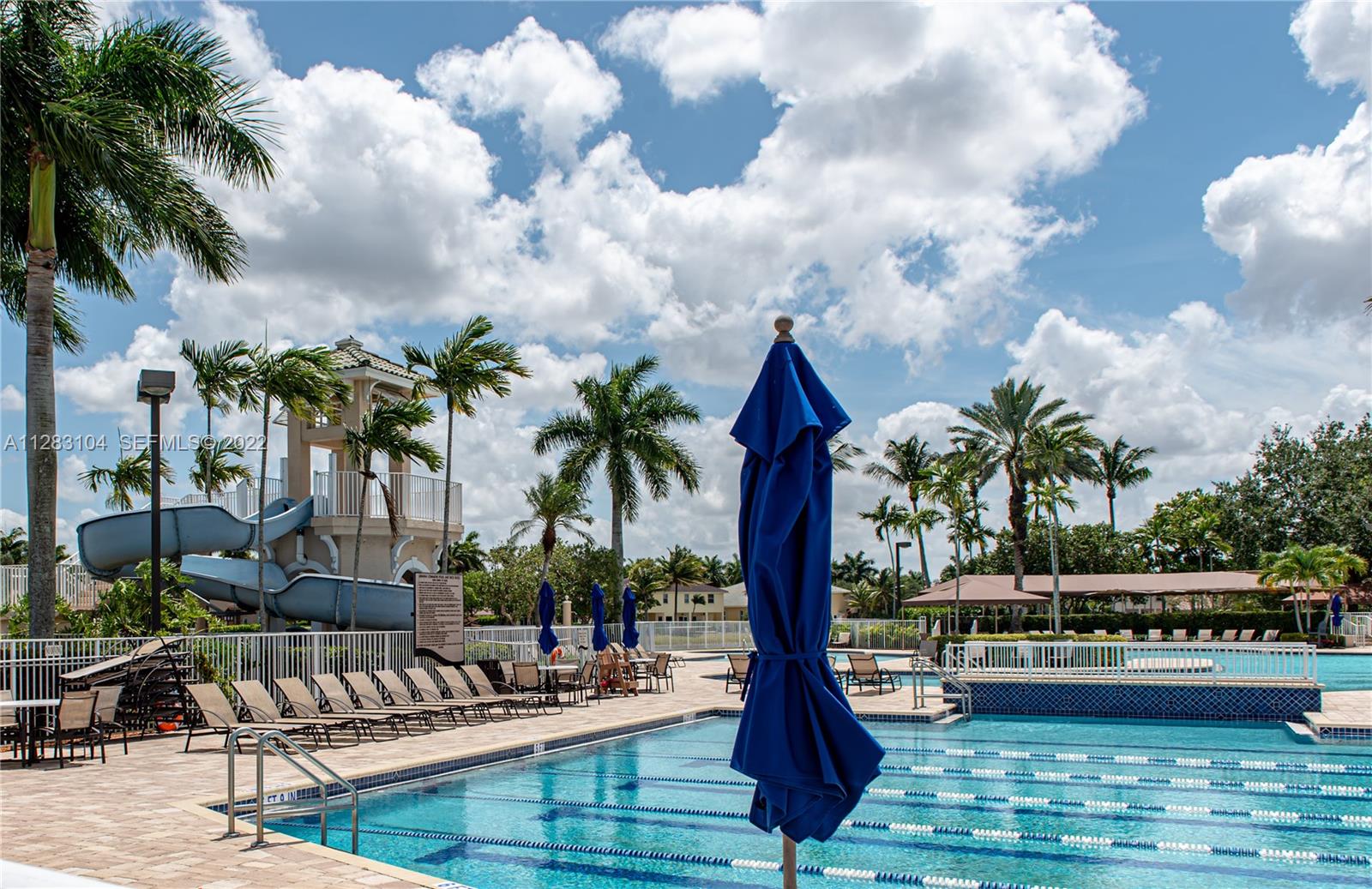 471 Fishtail Terrace Weston, FL 33327 - Photo 60 of 64 a view of yard with swimming pool and seating