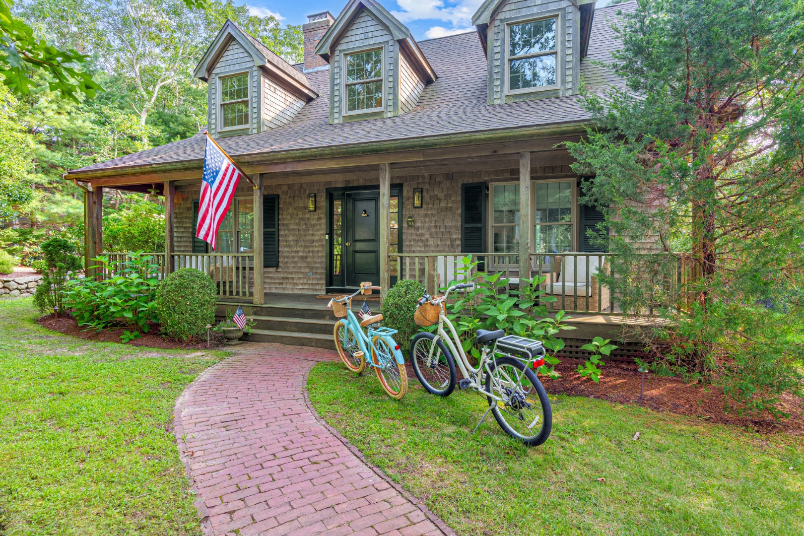 70 Marthas Road Edgartown, MA 02539 - Photo 3 of 54 a view of a chair and table in backyard of house