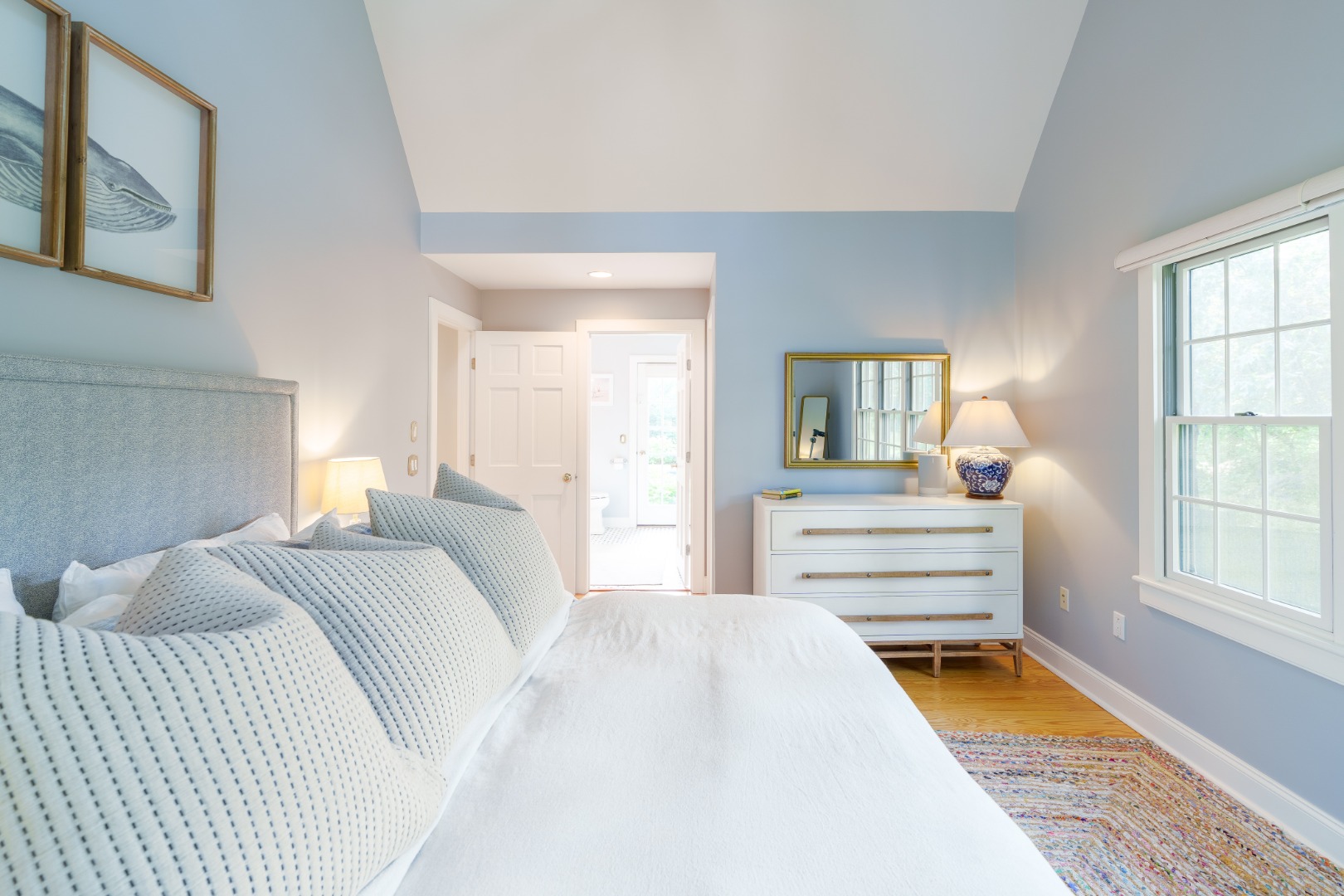 70 Marthas Road Edgartown, MA 02539 - Photo 31 of 54 a bedroom with a bed and wooden floor