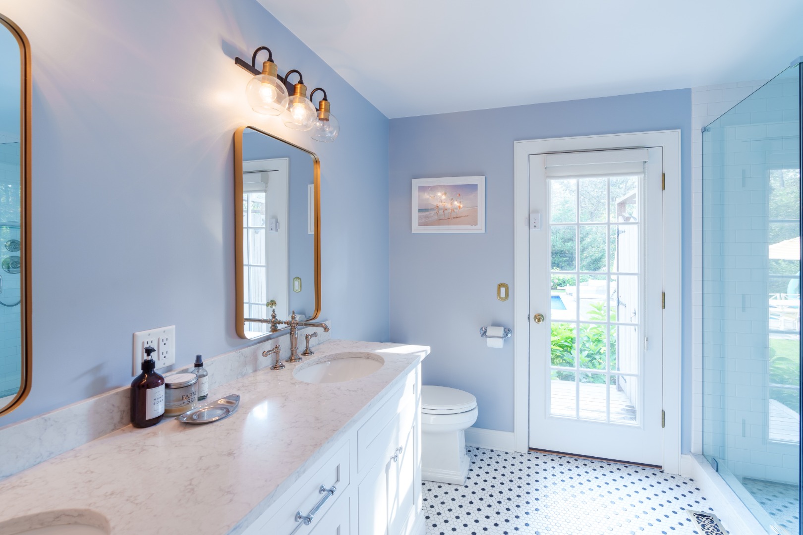 70 Marthas Road Edgartown, MA 02539 - Photo 32 of 54 a bathroom with a sink a toilet and a window