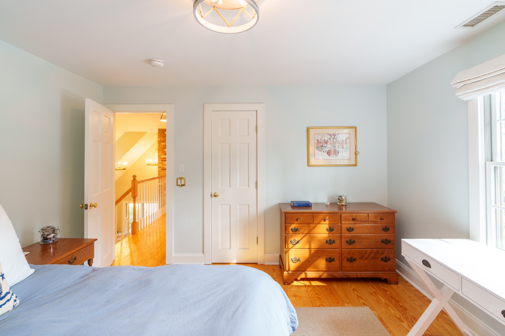 70 Marthas Road Edgartown, MA 02539 - Photo 41 of 54 a bedroom with a bed and wooden floor