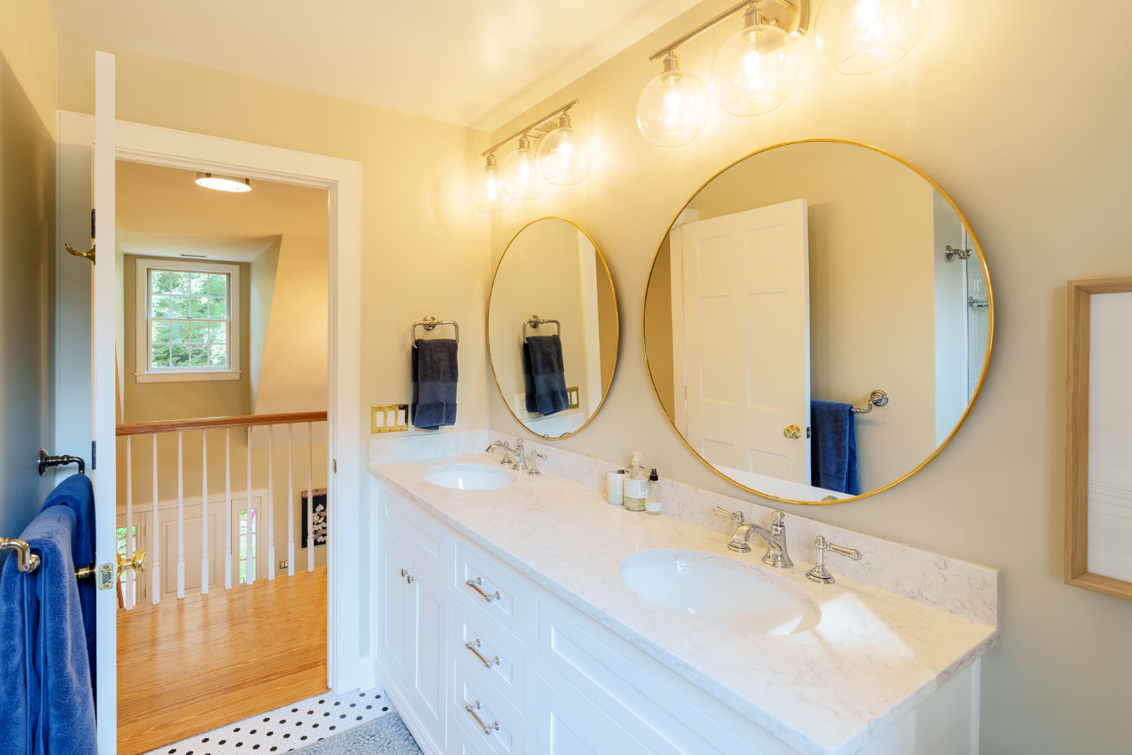 70 Marthas Road Edgartown, MA 02539 - Photo 44 of 54 a en suite bathroom with a double vanity sink and a mirror