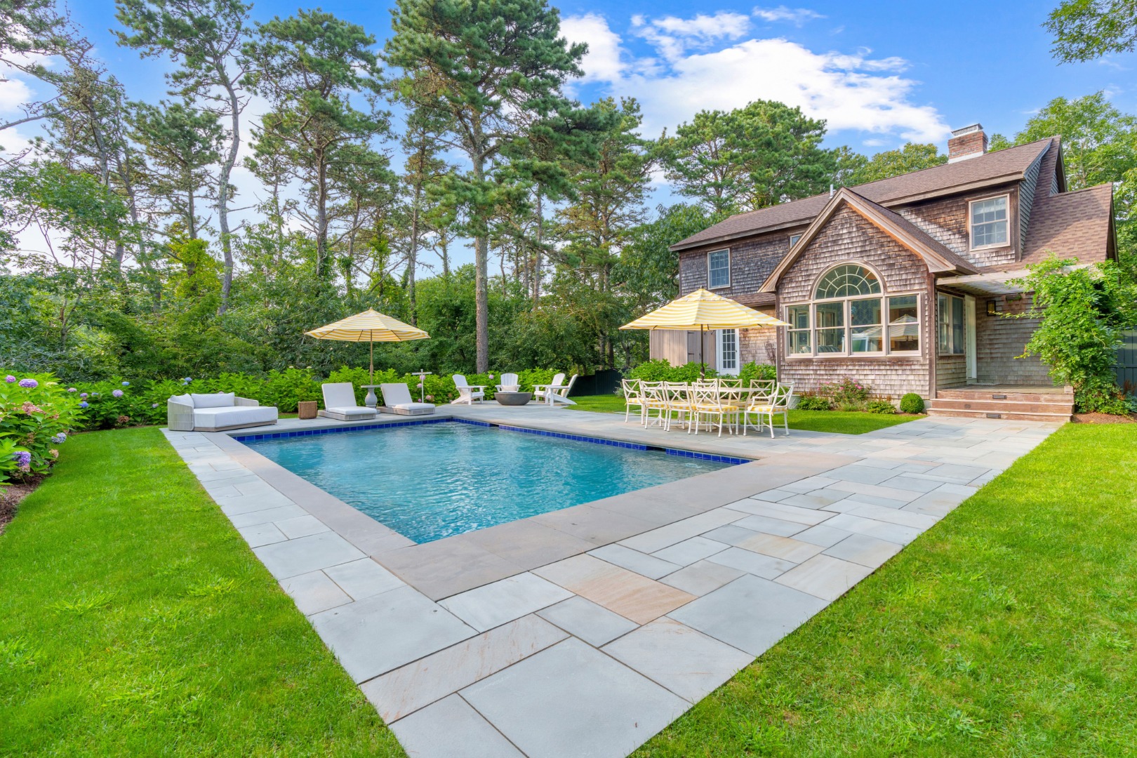 70 Marthas Road Edgartown, MA 02539 - Photo 50 of 54 a aerial view of a house with swimming pool and a yard