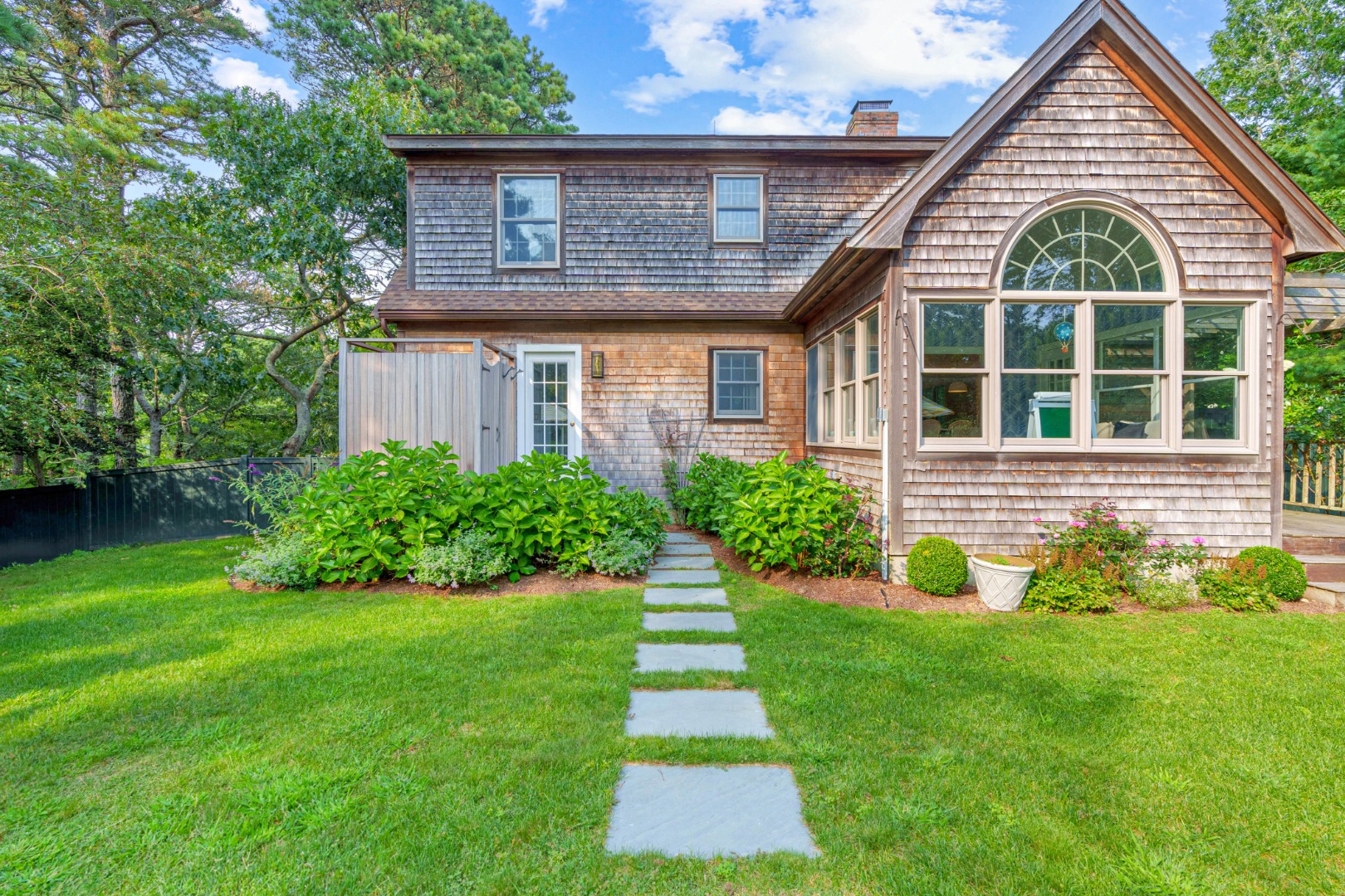 70 Marthas Road Edgartown, MA 02539 - Photo 51 of 54 a view of front of a house with a yard