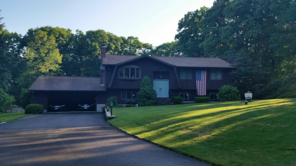 61 Morris Road Prospect, CT 06712 - Photo 1 of 1 a front view of a house with a yard