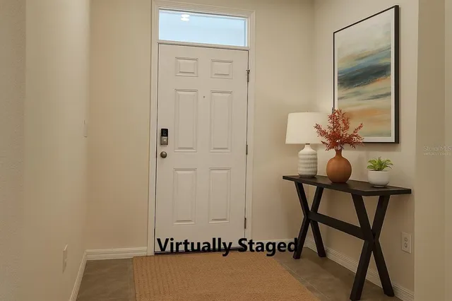 a view of a room with a table and chairs