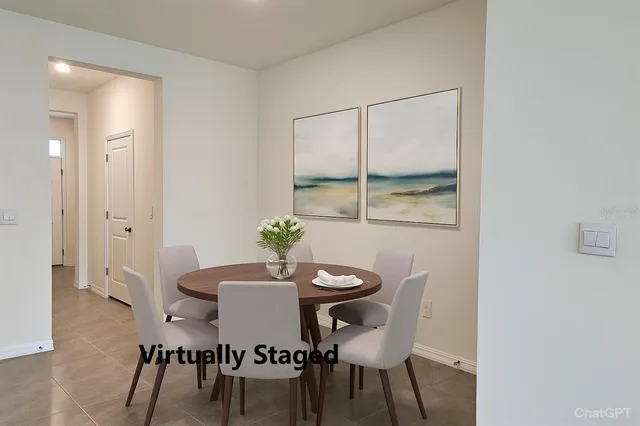 a view of a dining room with furniture and window