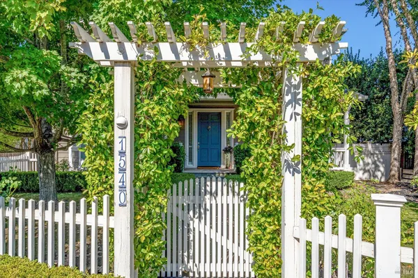 a view of a house with a small yard