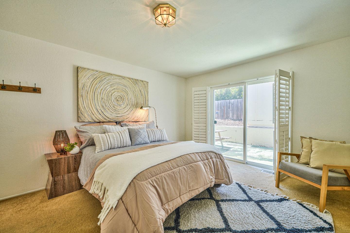 591 Belden Street Monterey, CA 93940 - Photo 14 of 27 a bedroom with a bed and a couch