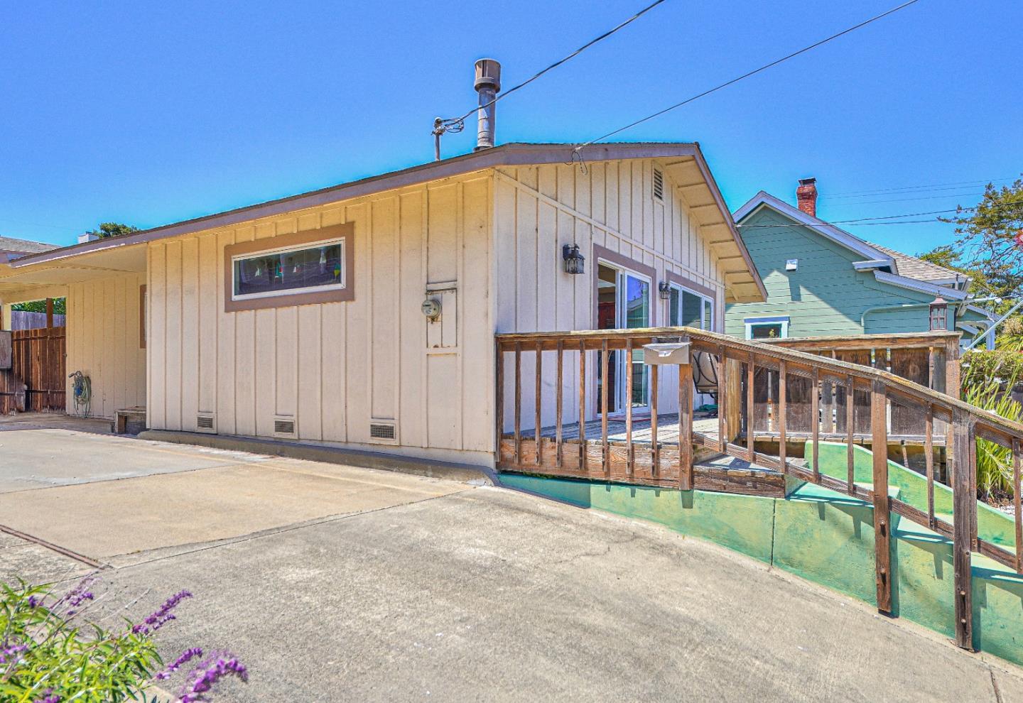 591 Belden Street Monterey, CA 93940 - Photo 23 of 27 a view of a house with a small yard and wooden fence
