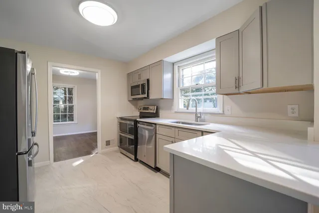 a view of an entryway with wooden floor