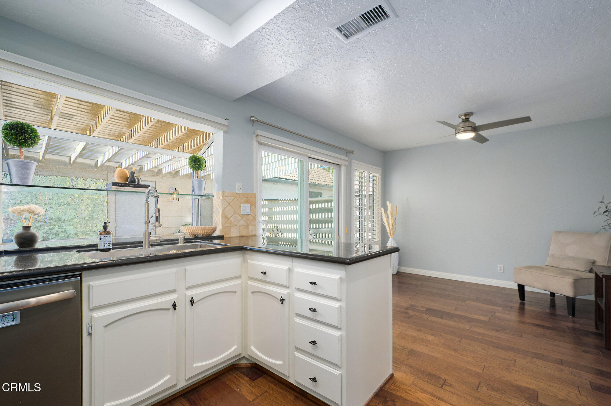 355 Jeremiah Drive, Unit D Simi Valley, CA 93065 - Photo 17 of 57 a kitchen with a sink window and cabinets
