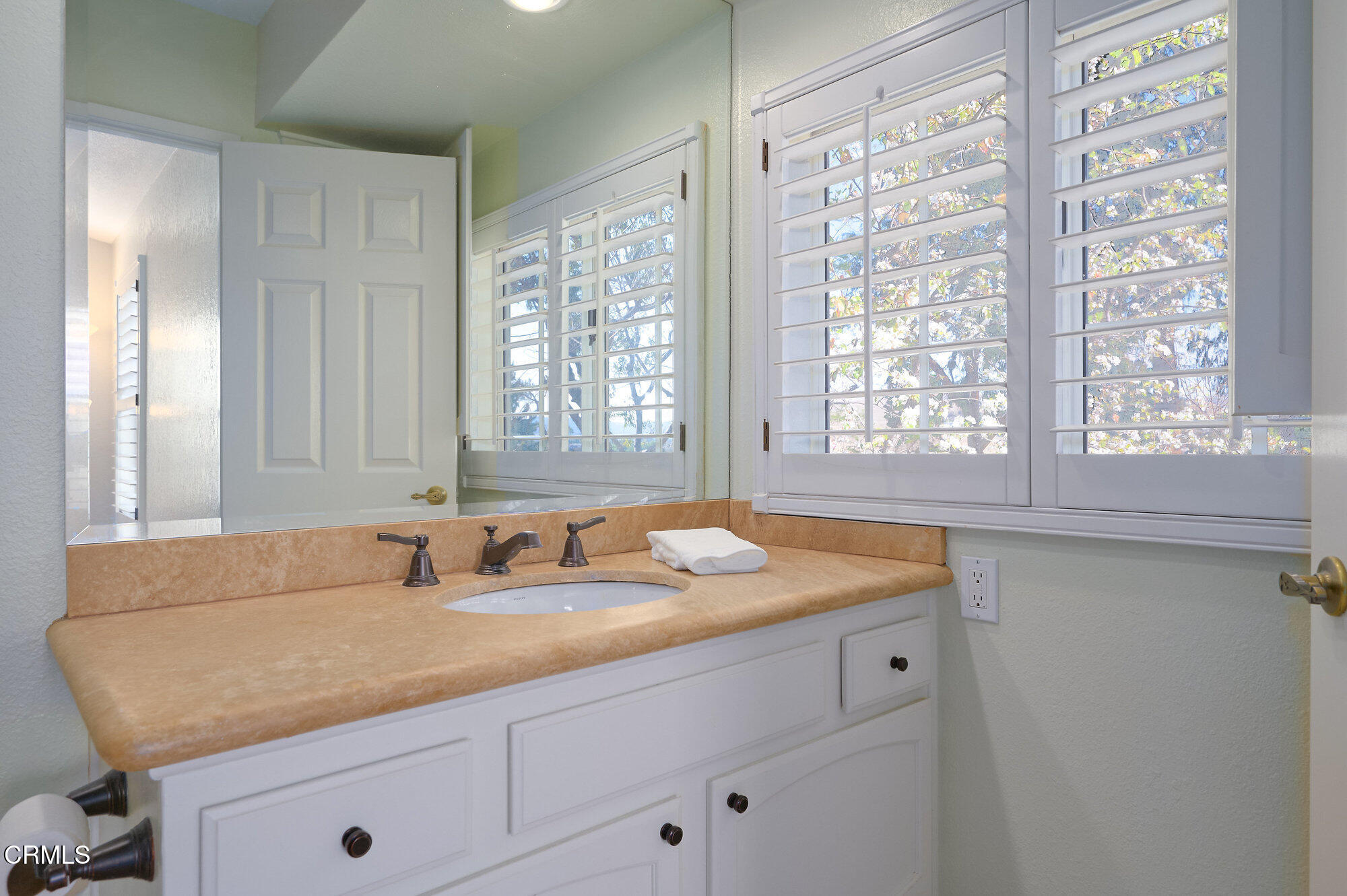 355 Jeremiah Drive, Unit D Simi Valley, CA 93065 - Photo 33 of 57 a kitchen with a granite countertop sink and window